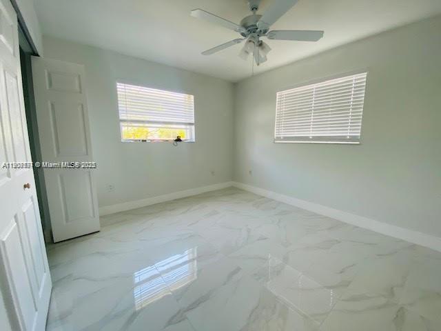 3432 Northwest 4th Street, Unit 2 Miami, FL 33125 - Photo 9 of 13 a view of empty room with windows