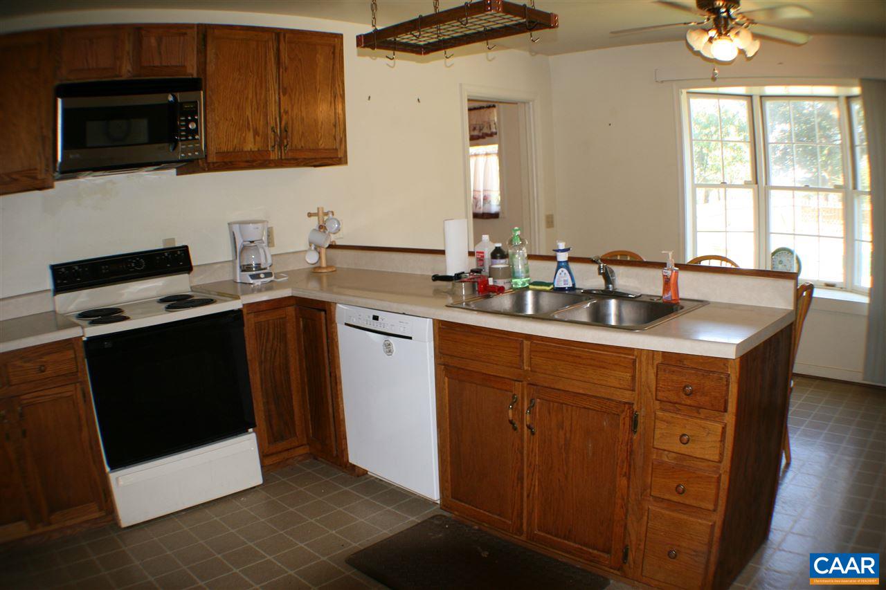 903 A Jacks Shop Road Rochelle, VA 22738 - Photo 5 of 10 a kitchen with stainless steel appliances granite countertop a sink stove and microwave