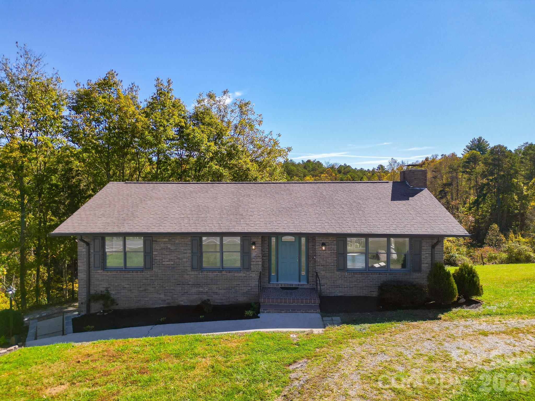 1248 Jenkins Valley Road Alexander, NC 28701 - Photo 12 of 43 a front view of a house with a yard