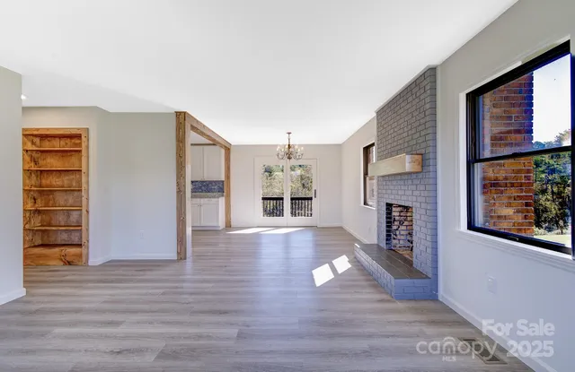 wooden floor in an empty room with a fireplace