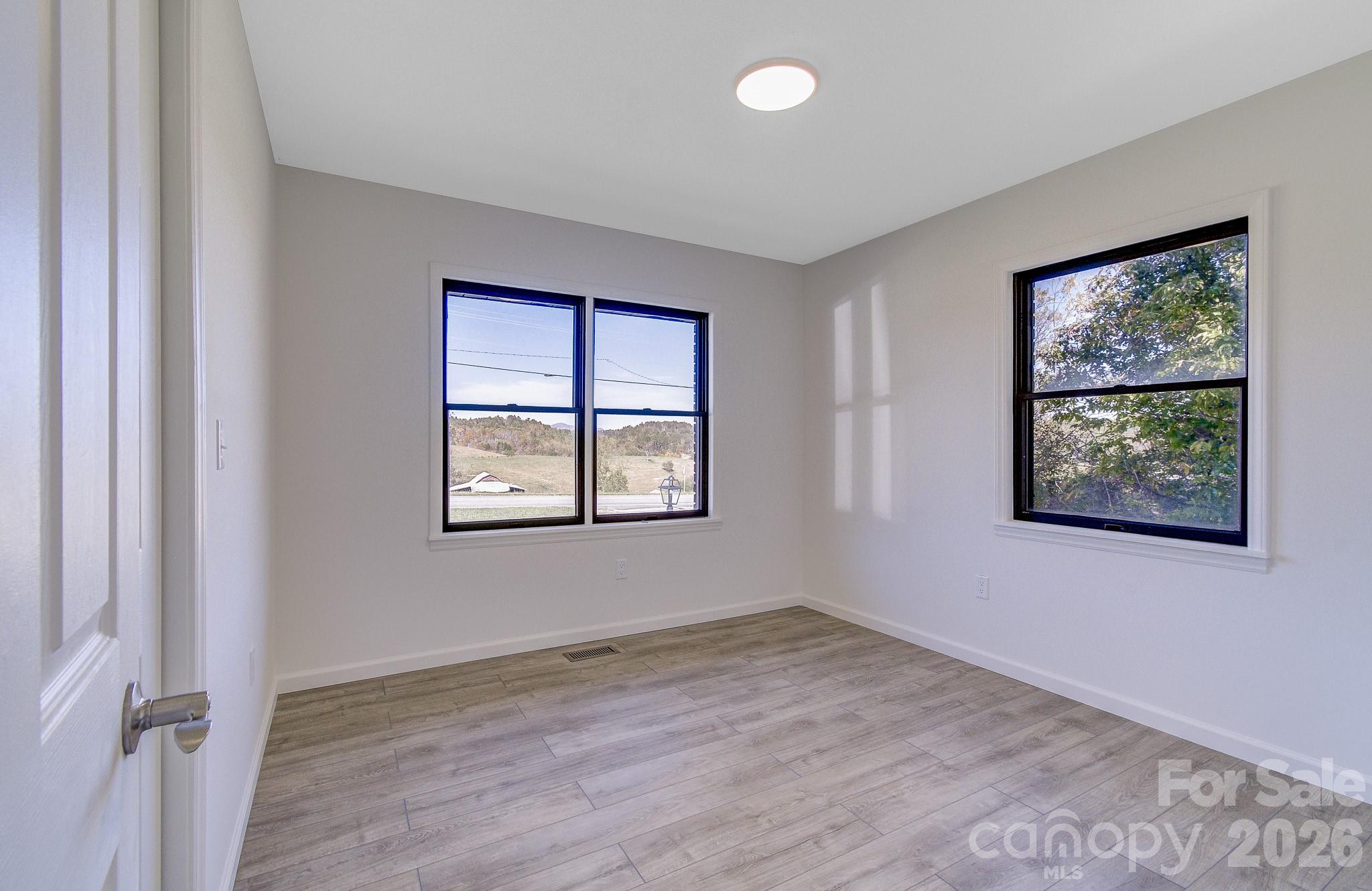 1248 Jenkins Valley Road Alexander, NC 28701 - Photo 22 of 43 an empty room with windows