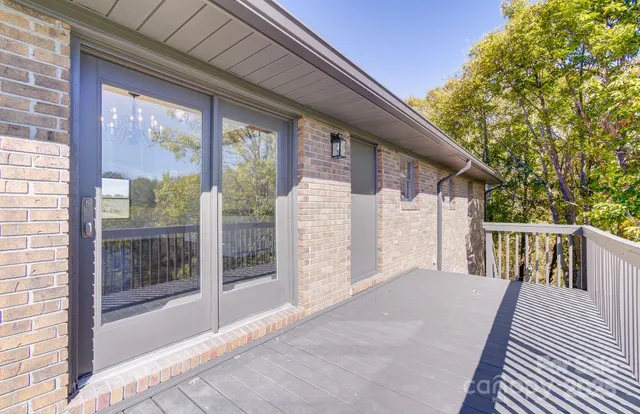 a bathroom with a granite countertop shower and a sink
