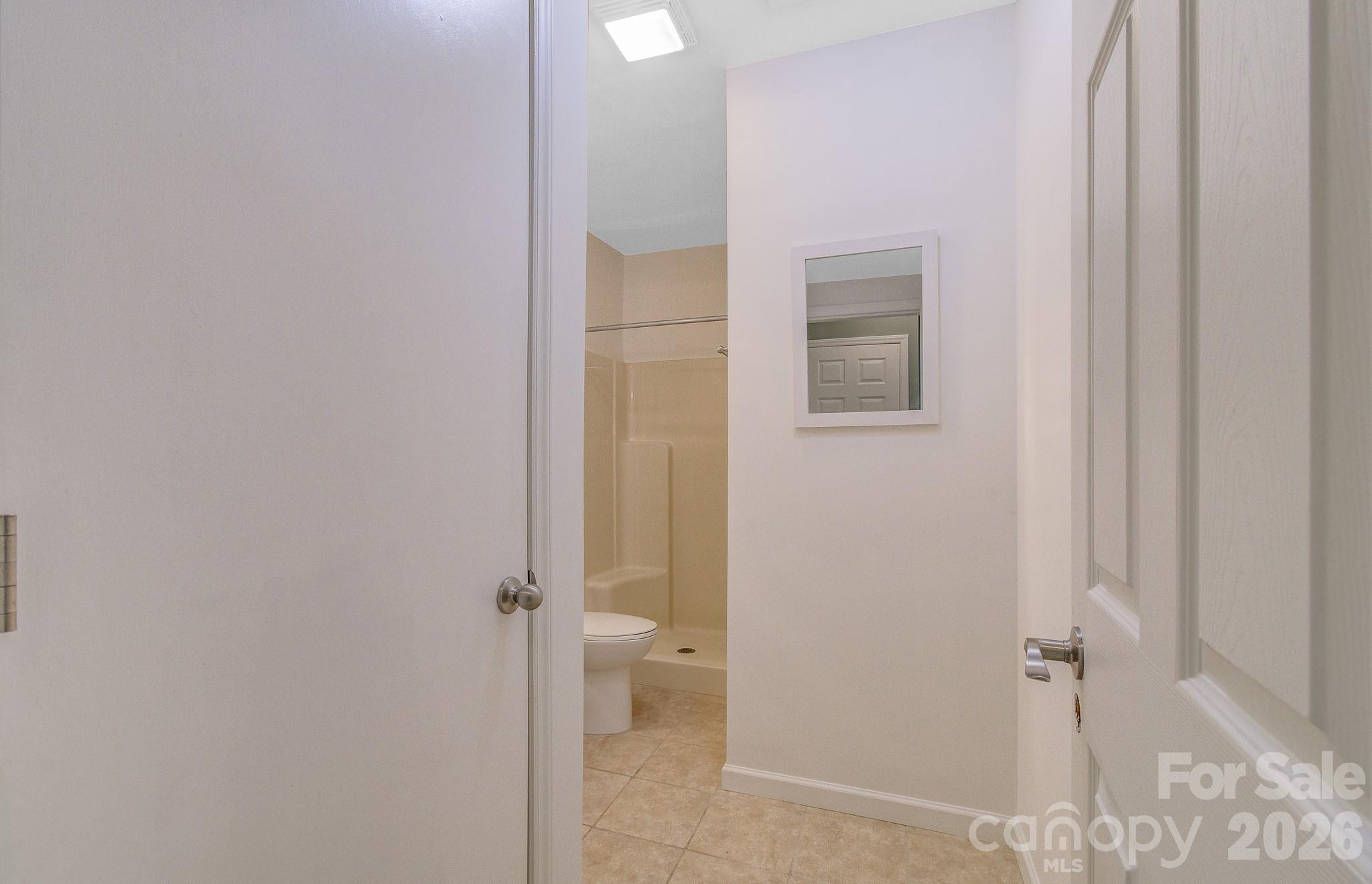 1248 Jenkins Valley Road Alexander, NC 28701 - Photo 35 of 43 a bathroom with a granite countertop shower and a sink
