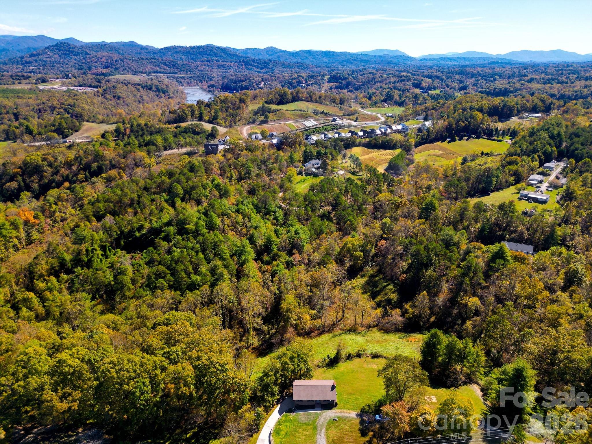 1248 Jenkins Valley Road Alexander, NC 28701 - Photo 38 of 43 an aerial view of residential house with an outdoor space and mountain view