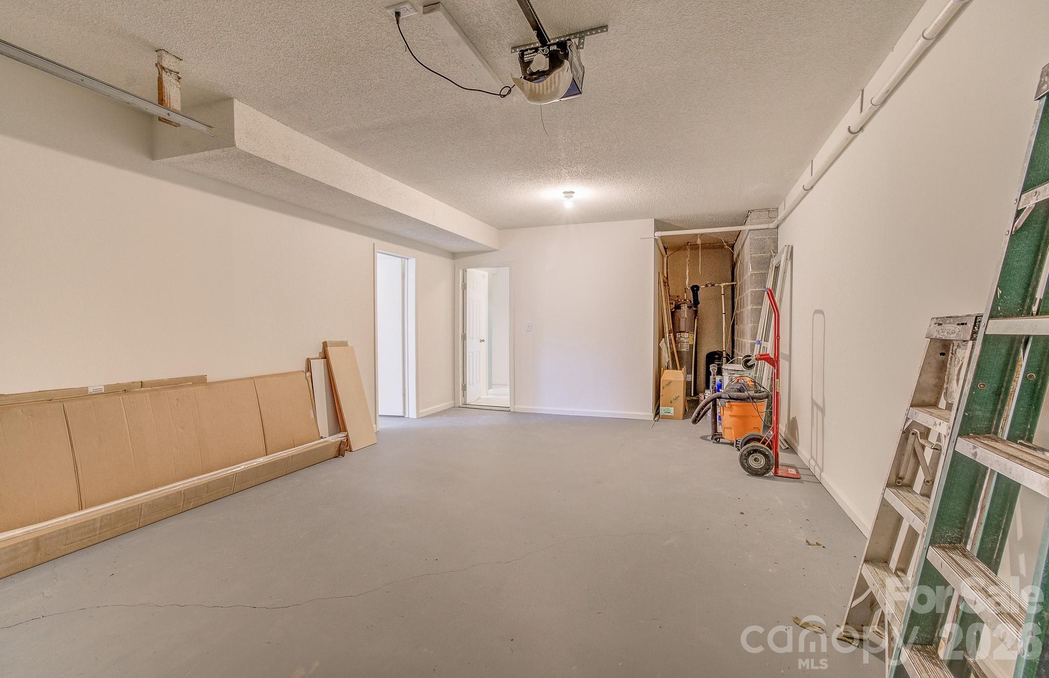 1248 Jenkins Valley Road Alexander, NC 28701 - Photo 42 of 43 a view of an empty room with furniture and a window