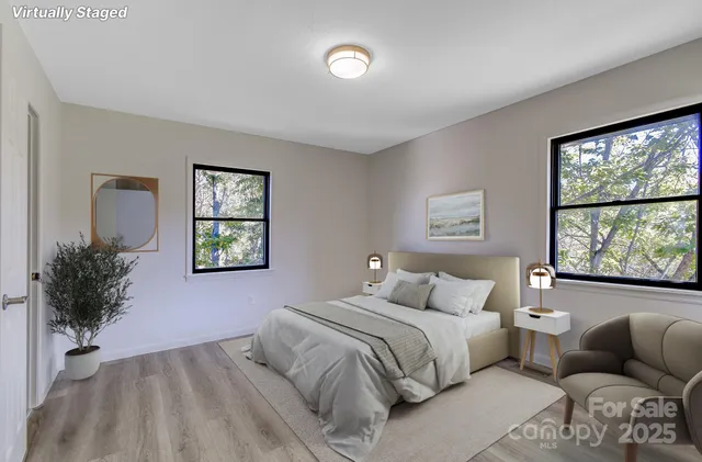 a bedroom with furniture and a window