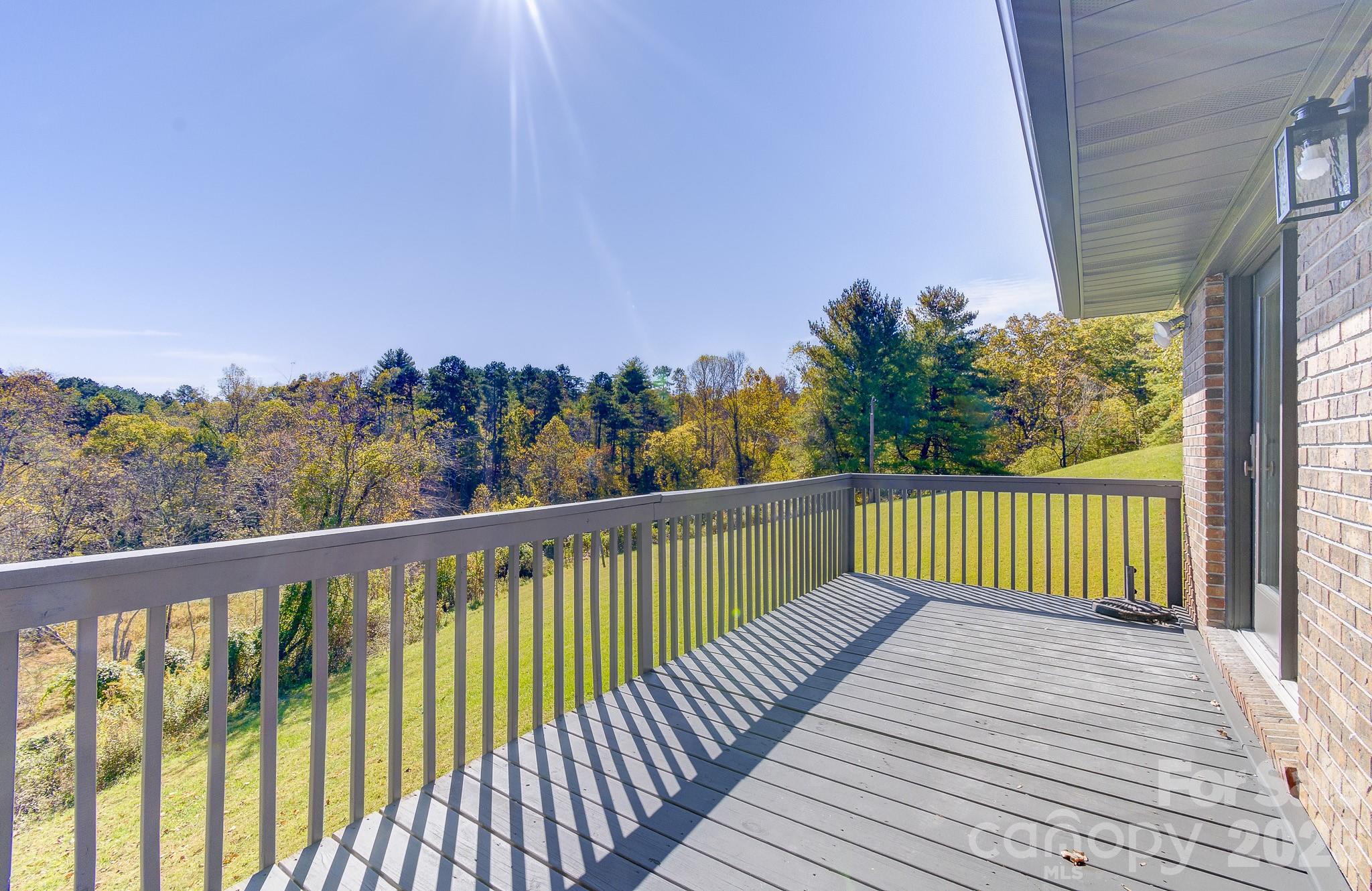 1248 Jenkins Valley Road Alexander, NC 28701 - Photo 10 of 43 a balcony with wooden floor and city view