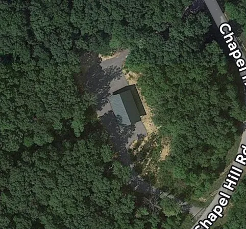 an aerial view of residential house with outdoor space