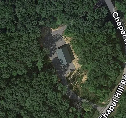 an aerial view of residential house with outdoor space