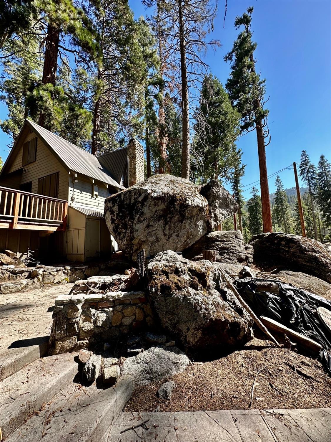 54758 Dinkey Creek Road Shaver Lake, CA 93664 - Photo 13 of 39 a view of a house with a patio