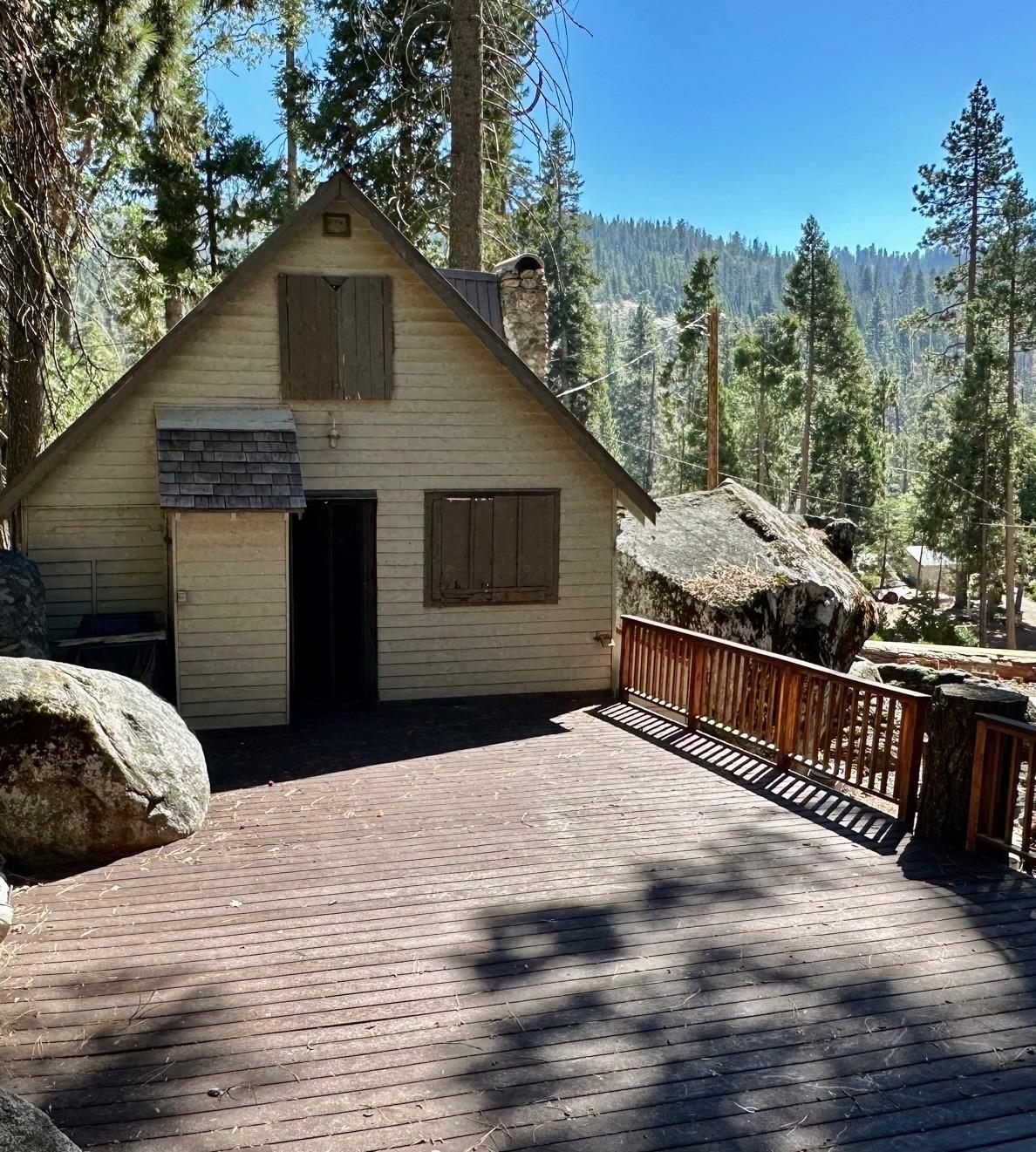 54758 Dinkey Creek Road Shaver Lake, CA 93664 - Photo 14 of 39 a front view of a house with a yard