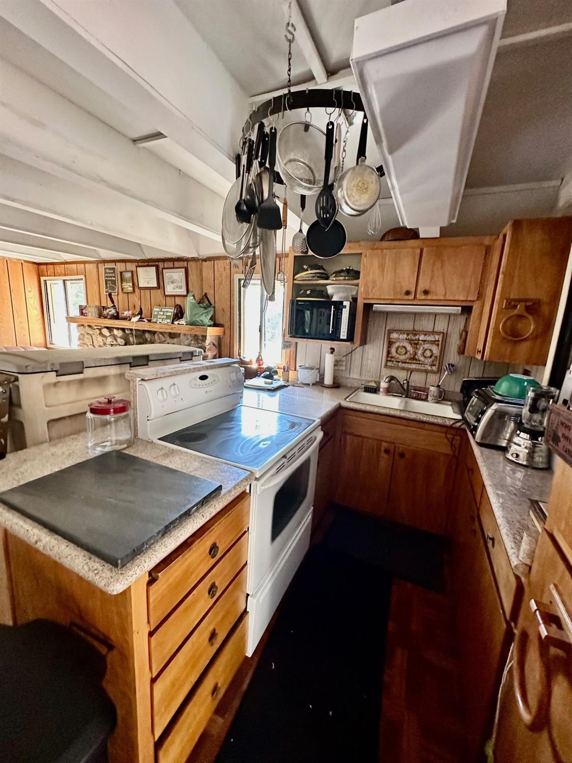 54758 Dinkey Creek Road Shaver Lake, CA 93664 - Photo 16 of 39 a kitchen that has a lot of cabinets in it