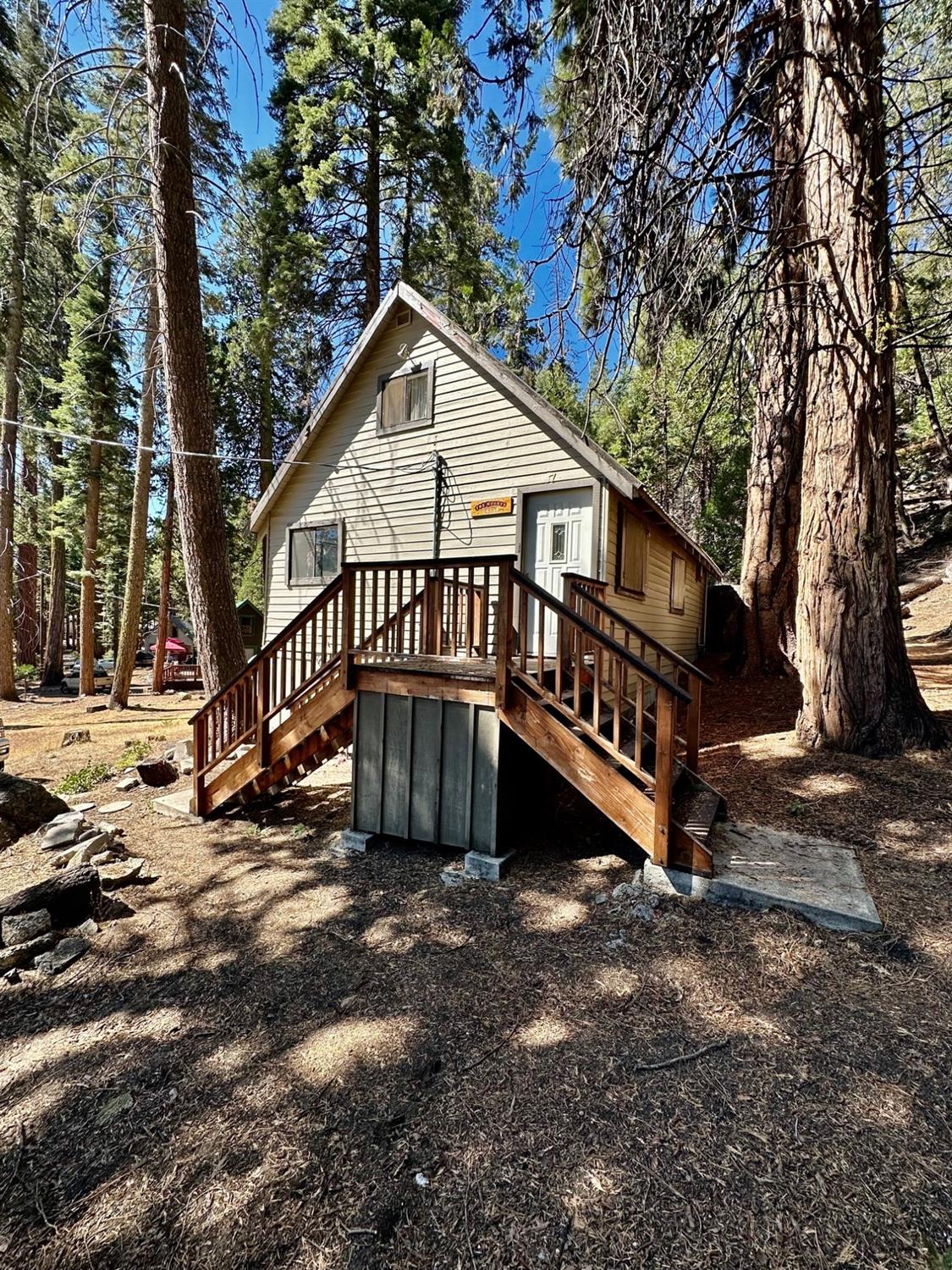 54758 Dinkey Creek Road Shaver Lake, CA 93664 - Photo 2 of 39 a view of a house with a yard