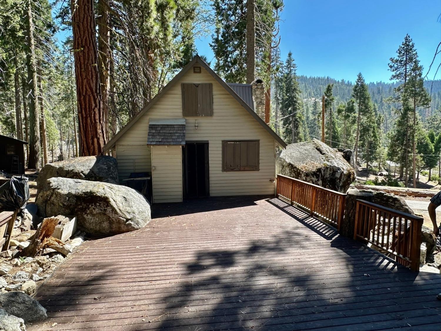 54758 Dinkey Creek Road Shaver Lake, CA 93664 - Photo 3 of 39 a house view with a outdoor space