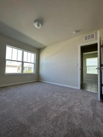 an empty room that has a window