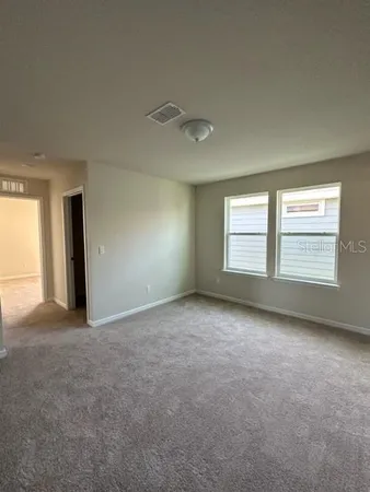 a view of a hallway with a room