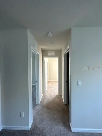 a bathroom with a granite countertop sink a toilet a mirror a vanity a bathtub and shower