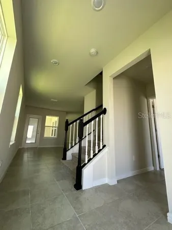 a view of entryway and hall with a window