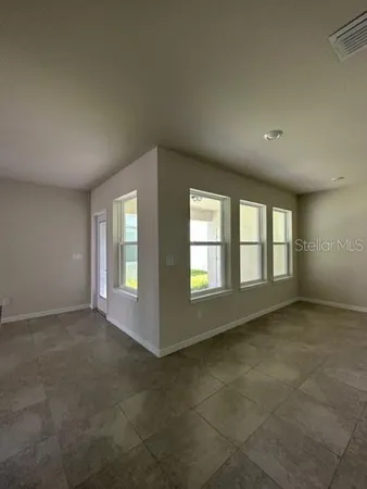 an empty room with windows