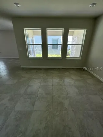 an empty room with windows