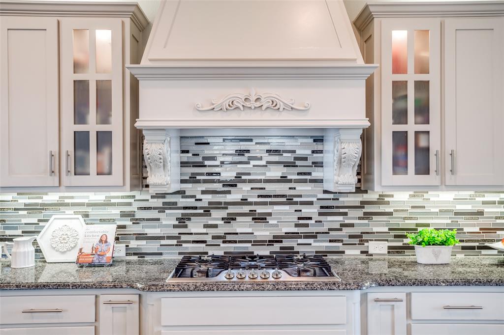 608 Arma Road Allen, TX 75002 - Photo 14 of 40 a kitchen with granite countertop a sink and a window
