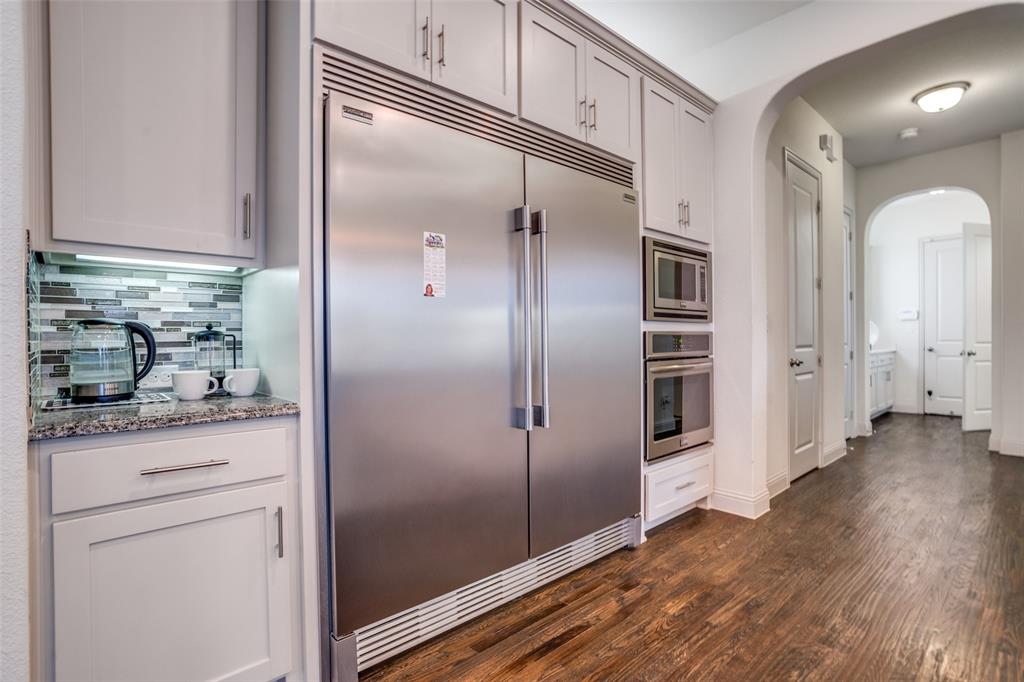 608 Arma Road Allen, TX 75002 - Photo 15 of 40 a kitchen with granite countertop cabinets and stainless steel appliances