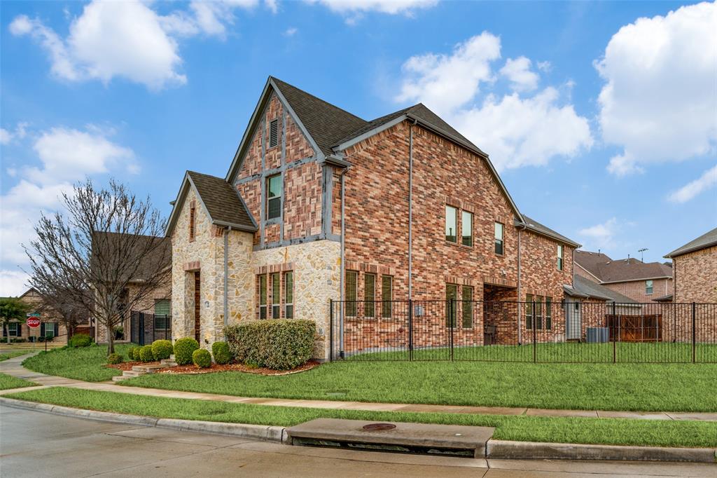 608 Arma Road Allen, TX 75002 - Photo 2 of 40 a view of a large building next to a yard