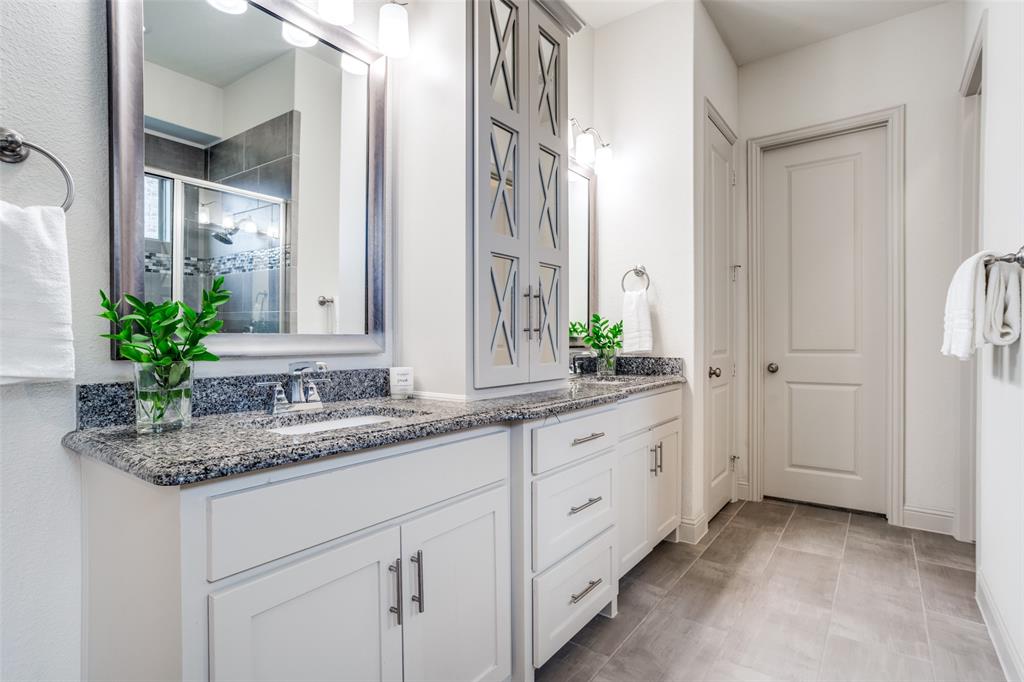 608 Arma Road Allen, TX 75002 - Photo 21 of 40 a bathroom with a granite countertop sink and a mirror