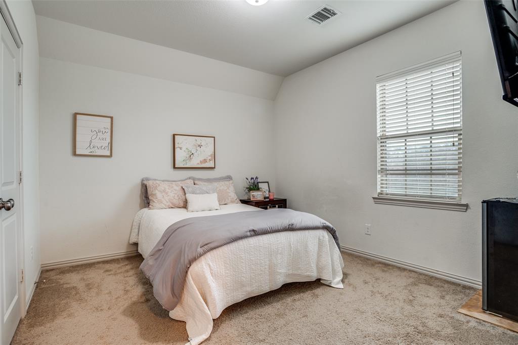 608 Arma Road Allen, TX 75002 - Photo 23 of 40 a bedroom with a bed and a window