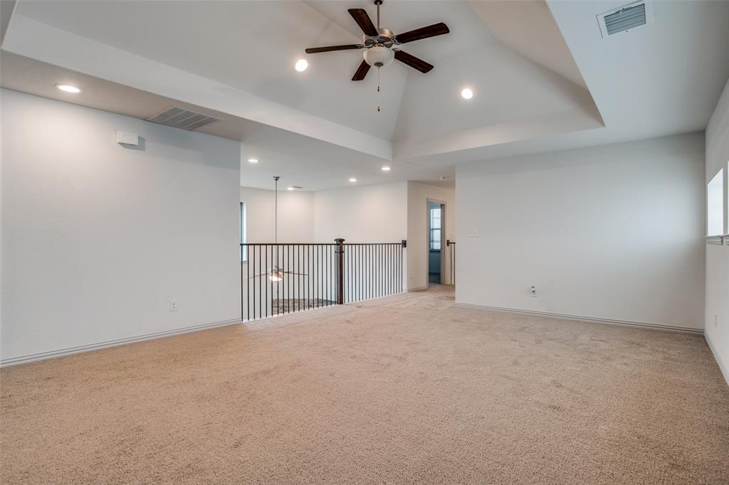 608 Arma Road Allen, TX 75002 - Photo 25 of 40 an empty room with windows and a ceiling fan