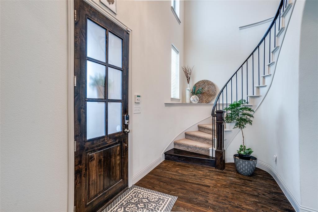608 Arma Road Allen, TX 75002 - Photo 3 of 40 a view of entryway and hall with wooden floor