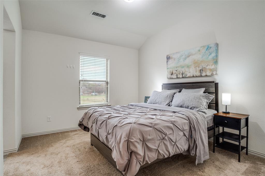 608 Arma Road Allen, TX 75002 - Photo 32 of 40 a bedroom with a bed and a window