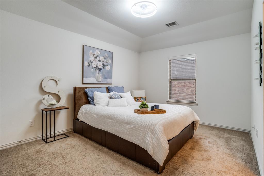 608 Arma Road Allen, TX 75002 - Photo 34 of 40 a bedroom with bed and a window