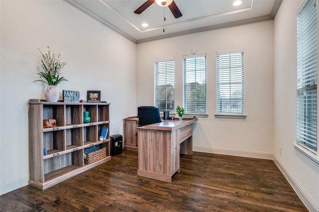 608 Arma Road Allen, TX 75002 - Photo 5 of 40 a living room with furniture and a book shelf