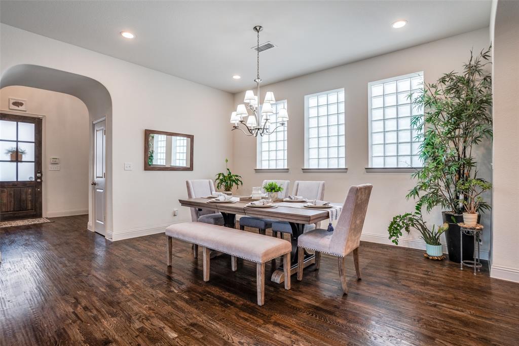 608 Arma Road Allen, TX 75002 - Photo 6 of 40 a view of a dining room with furniture window and wooden floor