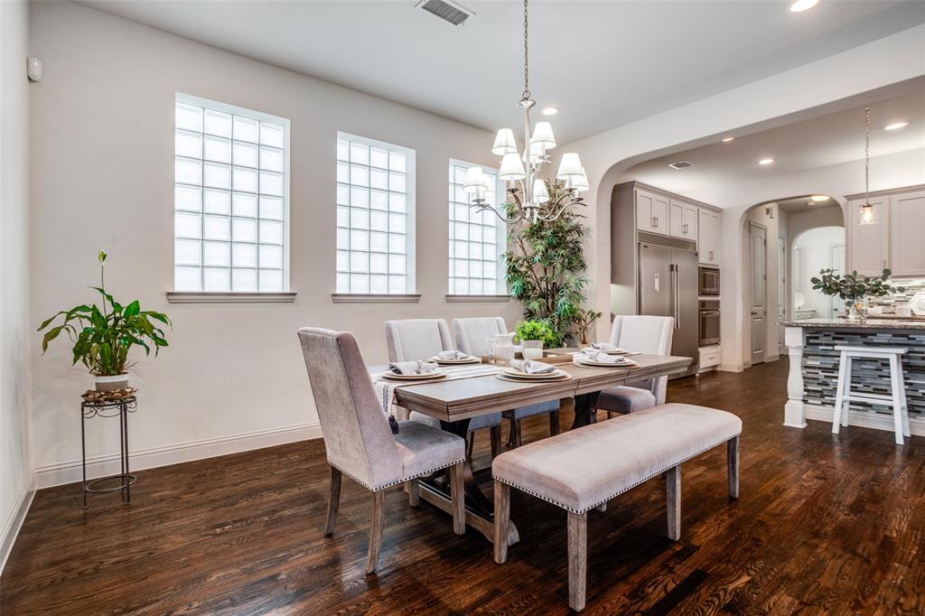 608 Arma Road Allen, TX 75002 - Photo 7 of 40 a view of a dining room with furniture window and wooden floor