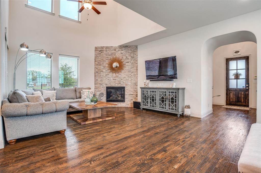 608 Arma Road Allen, TX 75002 - Photo 8 of 40 a living room with furniture and a fireplace