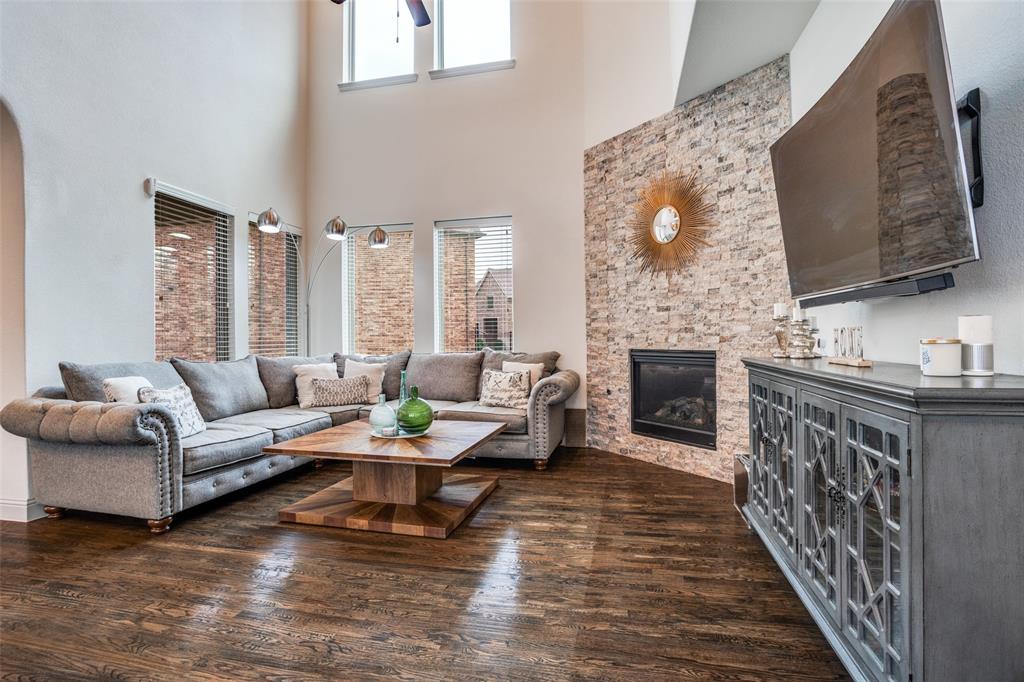 608 Arma Road Allen, TX 75002 - Photo 9 of 40 a living room with furniture and a fireplace