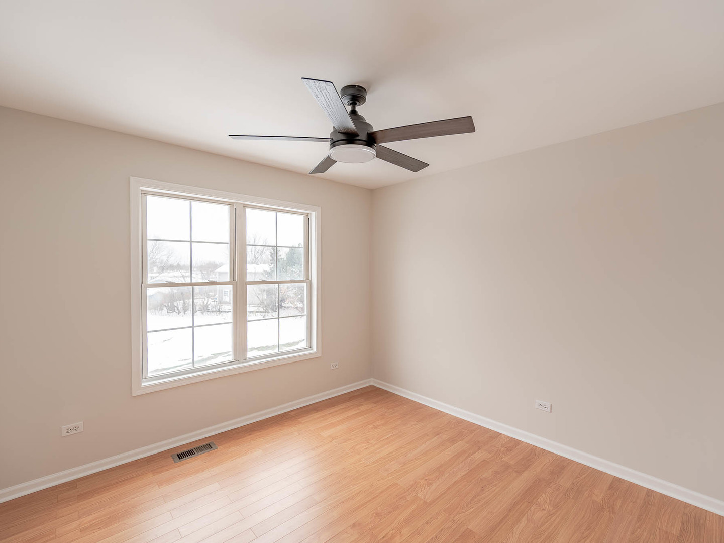 975 Merbach Court Carol Stream, IL 60188 - Photo 16 of 28 an empty room with a window and a fan