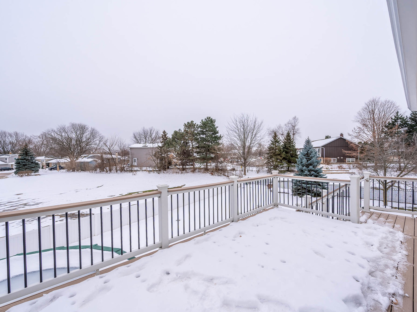 975 Merbach Court Carol Stream, IL 60188 - Photo 25 of 28 a balcony with wooden floor and fence
