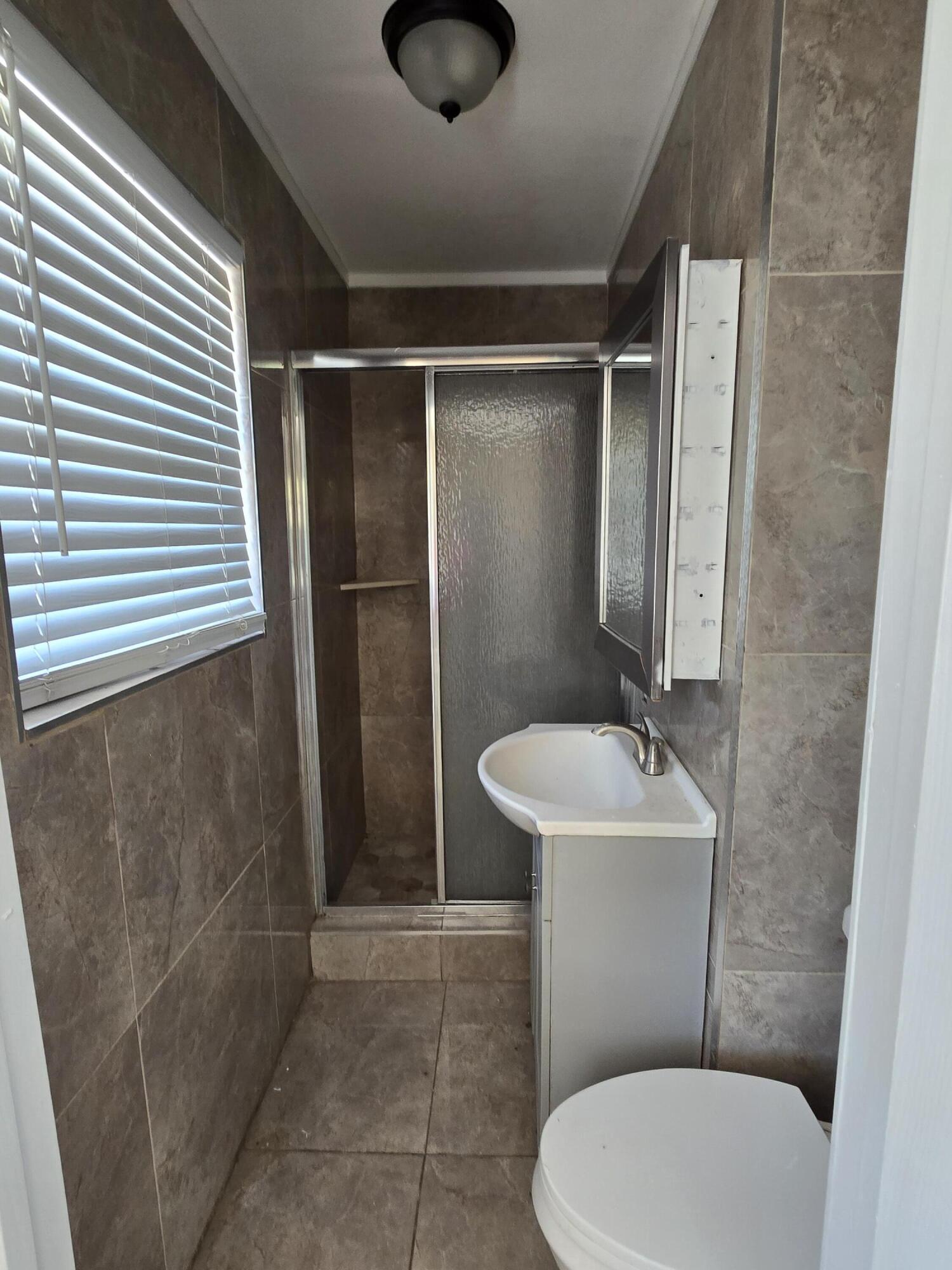 815 Silver Beach Road Lake Park, FL 33403 - Photo 6 of 9 Master bathroom
