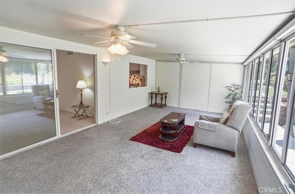 19427 Oak Crossing Road Newhall, CA 91321 - Photo 11 of 45 a living room with furniture and a chandelier