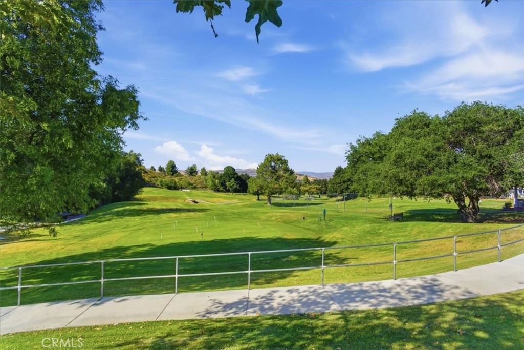 19427 Oak Crossing Road Newhall, CA 91321 - Photo 29 of 45 a view of a golf course with a lake view