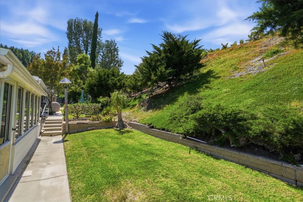 19427 Oak Crossing Road Newhall, CA 91321 - Photo 3 of 45 a view of a swimming pool with a patio