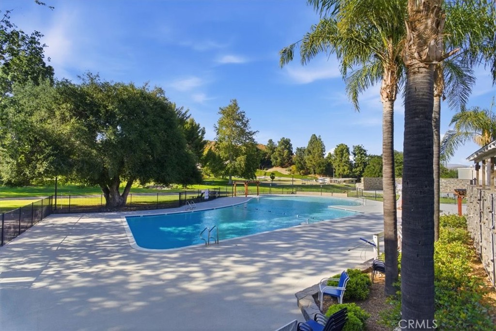 19427 Oak Crossing Road Newhall, CA 91321 - Photo 33 of 45 a view of a swimming pool with a patio