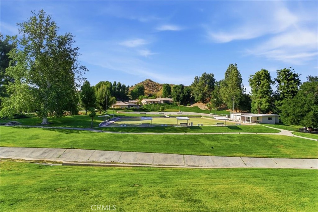 19427 Oak Crossing Road Newhall, CA 91321 - Photo 42 of 45 a swimming pool with trees in the background