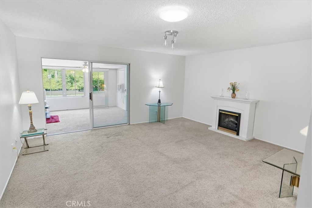 19427 Oak Crossing Road Newhall, CA 91321 - Photo 5 of 45 a view of a livingroom with furniture and a fireplace