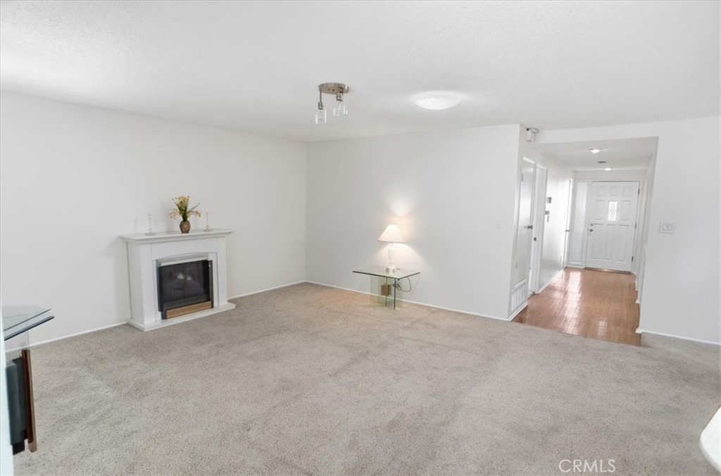 19427 Oak Crossing Road Newhall, CA 91321 - Photo 6 of 45 a view of a livingroom with a fireplace and window