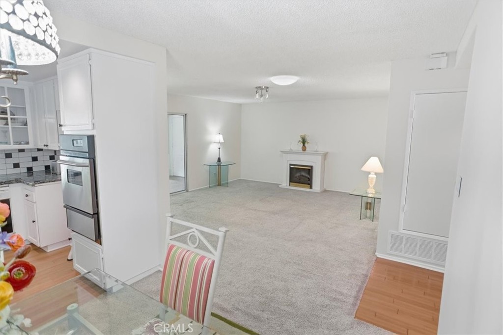 19427 Oak Crossing Road Newhall, CA 91321 - Photo 7 of 45 a view of empty room with furniture and fireplace