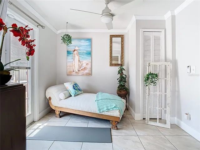 a view of a dining room with furniture and a book shelf